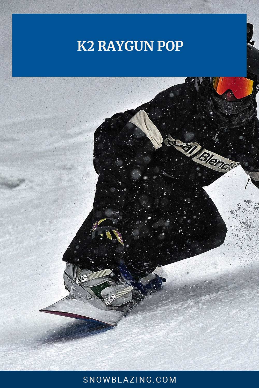 Man in black jacket and helmet snowboarding - K2 Raygun Pop