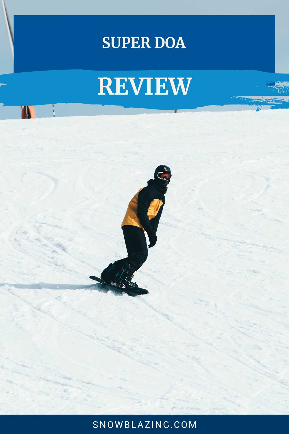 Man in yellow jacket with black sleeves snowboarding - Super DOA review