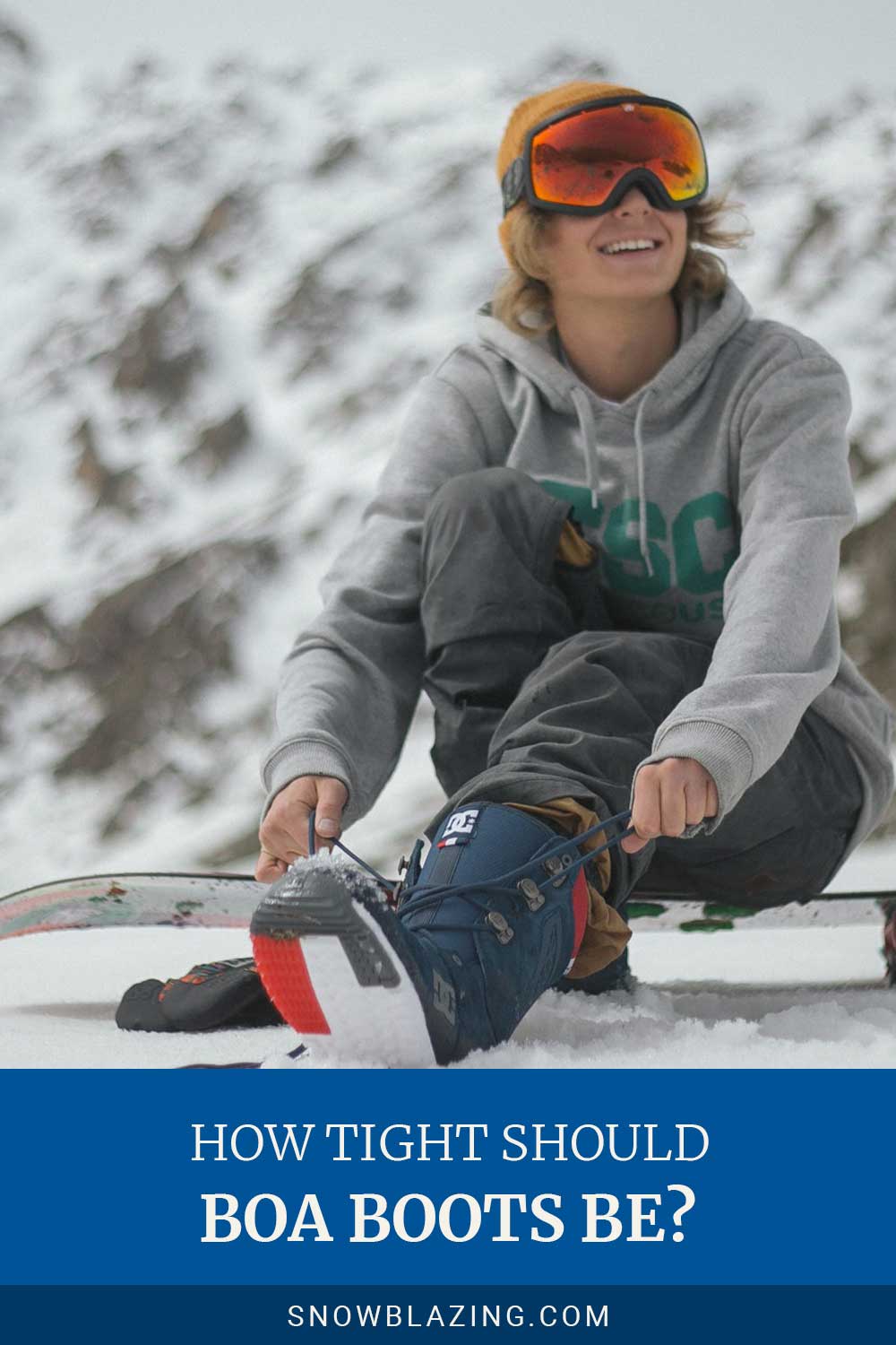 Woman lacing her shoelaces sitting on a snowboard - How Tight Should Boa Boots Be?